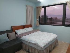 Postel nebo postele na pokoji v ubytování Chin-Lan B&B