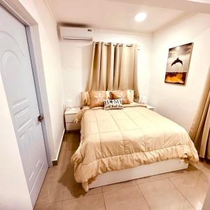 Ένα ή περισσότερα κρεβάτια σε δωμάτιο στο Central in Punta Cana Beach Life RD