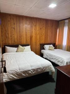 Postel nebo postele na pokoji v ubytování Single Tree Hotel