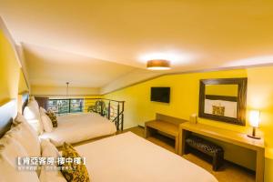 Katil atau katil-katil dalam bilik di Leofoo Resort Guanshi