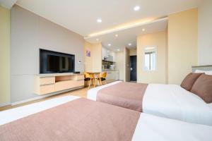 TV a/nebo společenská místnost v ubytování Jeju M Resort