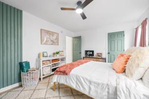 a bedroom with green doors and a bed at Emerald Horizon by Logan (104 Azalea Ct) in Clarksville