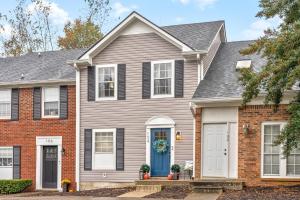 a house with a blue door at Emerald Horizon by Logan (104 Azalea Ct) in Clarksville