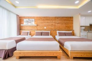 Postel nebo postele na pokoji v ubytování Jeju M Resort