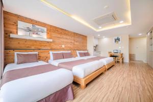 Postel nebo postele na pokoji v ubytování Jeju M Resort