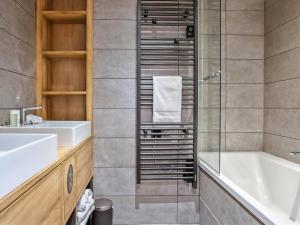 a bathroom with a tub and a sink and a shower at Chalet luxueux avec jacuzzi, 7 pièces, proche pistes, pour 15 pers. - FR-1-810-28 in Hauteluce