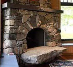a stone fireplace in a room with a window at Cabañas Calpulalpan de paso in San Cristóbal Zacacalco +1 photo