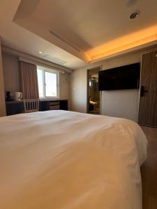 Postel nebo postele na pokoji v ubytování 衿后禾居Good Hotel