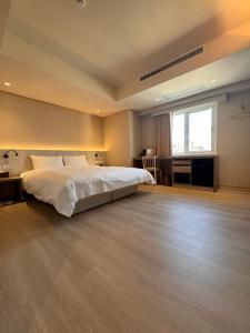 Postel nebo postele na pokoji v ubytování 衿后禾居Good Hotel