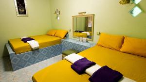 Katil atau katil-katil dalam bilik di แฝดสามการ์เด้นท์รีสอร์ท