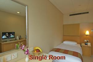 Letto o letti in una camera di The Salisbury - YMCA of Hong Kong