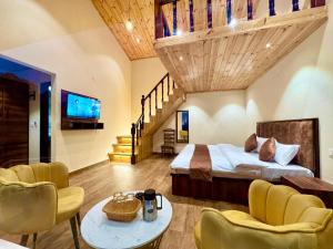 a hotel room with a bed and a staircase at Kasauli Pine Hill Cottages I Kasauli in Kasauli +77 photos