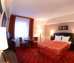 Ein Bett oder Betten in einem Zimmer der Unterkunft Hotel San Remo
