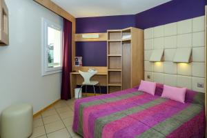 Postel nebo postele na pokoji v ubytování Hotel Espace Cite + 35 fotografií