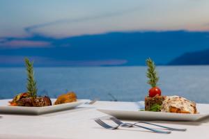 two plates of food sitting on a table at Lukka Exclusive Hotel – Adult Only +12 in Kaş