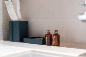 two bottles of honey sitting on a shelf at Laguna Beachside Residents in Phuket +21 photos