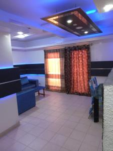 a living room with a couch and a table at Residence AMEV in Dakar