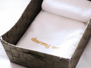 Cama ou camas em um quarto em Dormy Inn Wakkanai