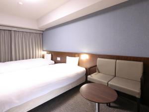 Cama ou camas em um quarto em Dormy Inn Wakkanai mais 37 fotos