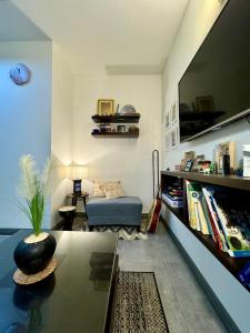a living room with a couch and a table at Gulberg Heights in Islamabad +16 photos