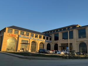 a large building with cars parked in front of it at Sea Breeze, "Park Residence-2" in Baku