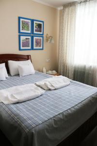 Кровать или кровати в номере VitaPark Solnechniy Provans