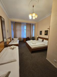 Ένα ή περισσότερα κρεβάτια σε δωμάτιο στο Hotel Arche