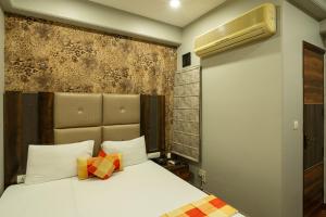 Postel nebo postele na pokoji v ubytování Hotel Sunstar Grand