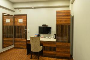 TV a/nebo společenská místnost v ubytování Hotel Sunstar Grand