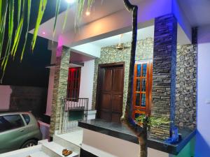 a house with a car parked in front of it at SFS Villa in Kappil