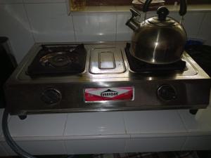 a tea kettle sitting on top of a stove at Villa Pipe Dream in Tangalle