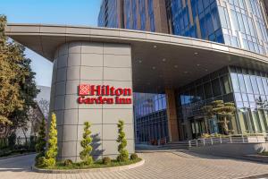 a building with a hilton garden inn sign on it at Hilton Garden Inn Baku in Baku