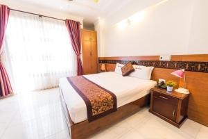 Letto o letti in una camera di Dai Long Hotel