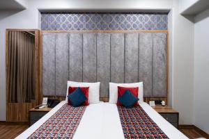 Postel nebo postele na pokoji v ubytování Hotel Sunstar Grand