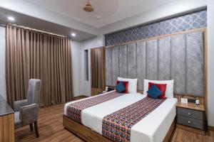 Postel nebo postele na pokoji v ubytování Hotel Sunstar Grand