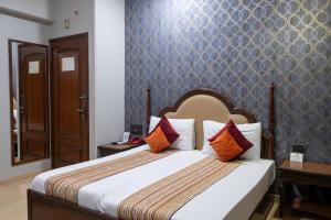 Postel nebo postele na pokoji v ubytování Hotel Sunstar Grand