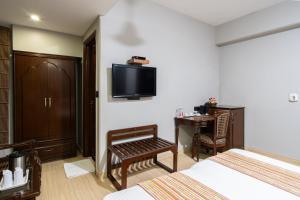 TV a/nebo společenská místnost v ubytování Hotel Sunstar Grand