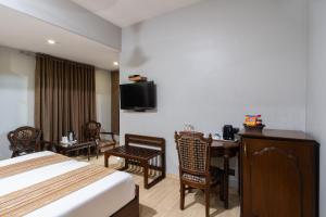 TV a/nebo společenská místnost v ubytování Hotel Sunstar Grand