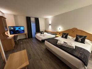 Posteľ alebo postele v izbe v ubytovaní Hotel Isolabella Wellness