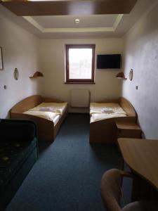 Ein Bett oder Betten in einem Zimmer der Unterkunft Penzión DRUŽBA Bojnice