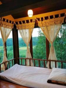 Postel nebo postele na pokoji v ubytování Khunyuam Resort