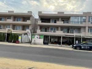a car parked in front of a building at Paula in Curtea de Argeş