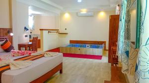 Postel nebo postele na pokoji v ubytování Sigiriya Water Cottage