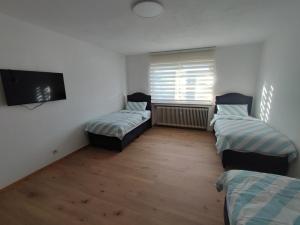 Ένα ή περισσότερα κρεβάτια σε δωμάτιο στο Stadt Ap Heidenheim