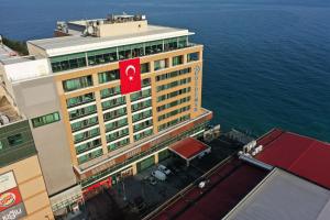 an overhead view of a building with a red sign on it at Dedeman Zonguldak in Zonguldak