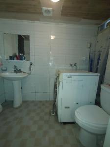 a bathroom with a toilet and a sink at Sinchon House close to the airport in Seoul