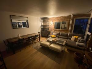 a living room with a couch and a table at Liberté Room 2 Chambre privée en colocation conviviale ! in Nanterre