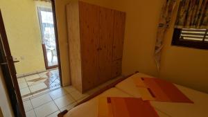 Postel nebo postele na pokoji v ubytování Apartments Dario
