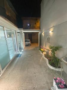 an empty hallway of a house at night at Luxury Rosaverde in Frattamaggiore
