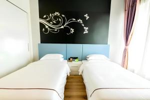 Postel nebo postele na pokoji v ubytování 云鹰加州酒店 + 20 fotografií